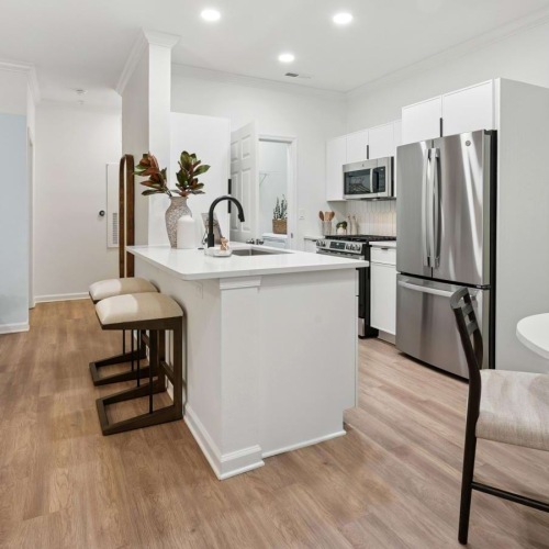 a kitchen with white cabinets