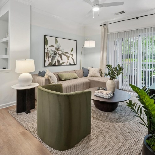 a living room with a couch and chairs