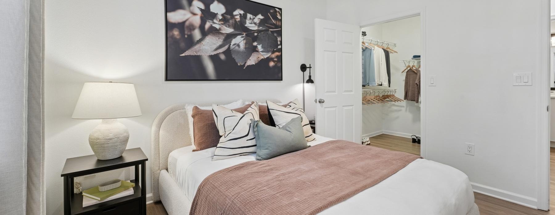 a bedroom with a bed and a lamp